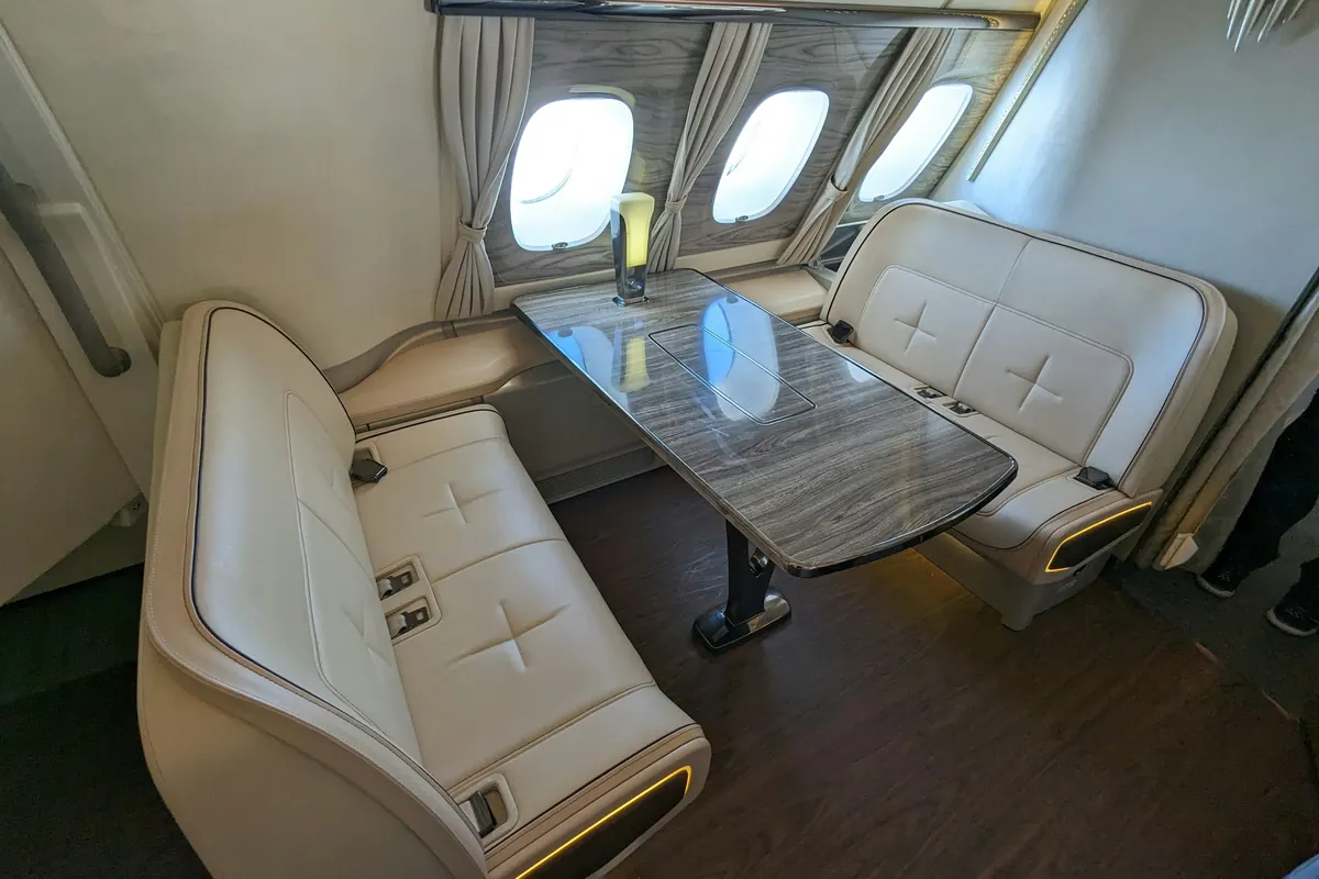 Club seating around a table in a private aircraft cabin